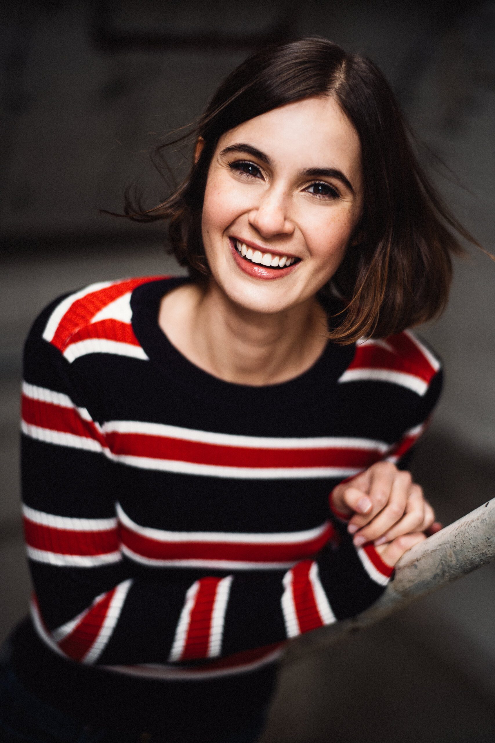 Ariela is smiling at the camera.