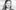 Brianna is smiling at the camera. The image is black and white.