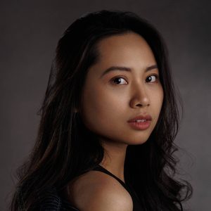 Bernice is looking over her shoulder at the camera.