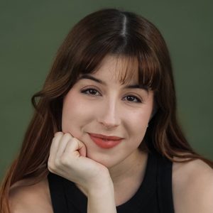 Jadon is smiling at the camera.