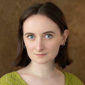 Jen is looking at the camera.