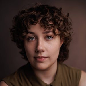 Marty is looking at the camera.