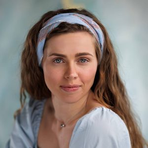 Kiki is looking at the camera.