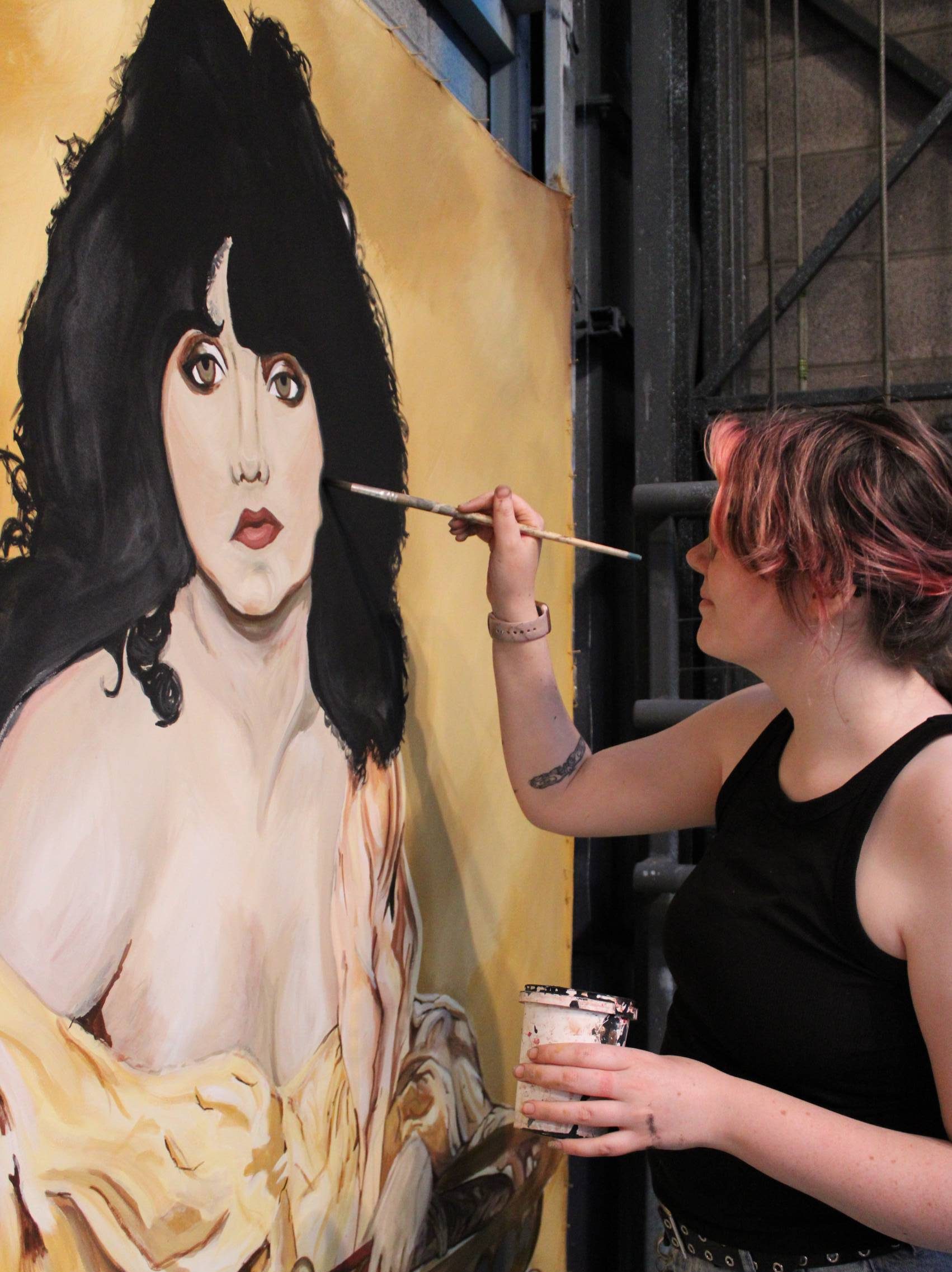 Eilidh is painting a portrait.