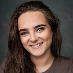 Kirsty is smiling at the camera