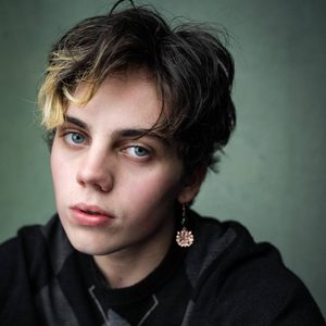 Sheridan is looking at the camera/