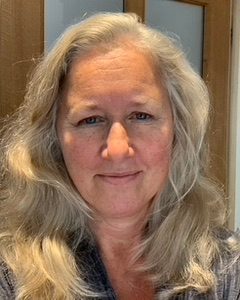 Sophie is smiling at the camera.