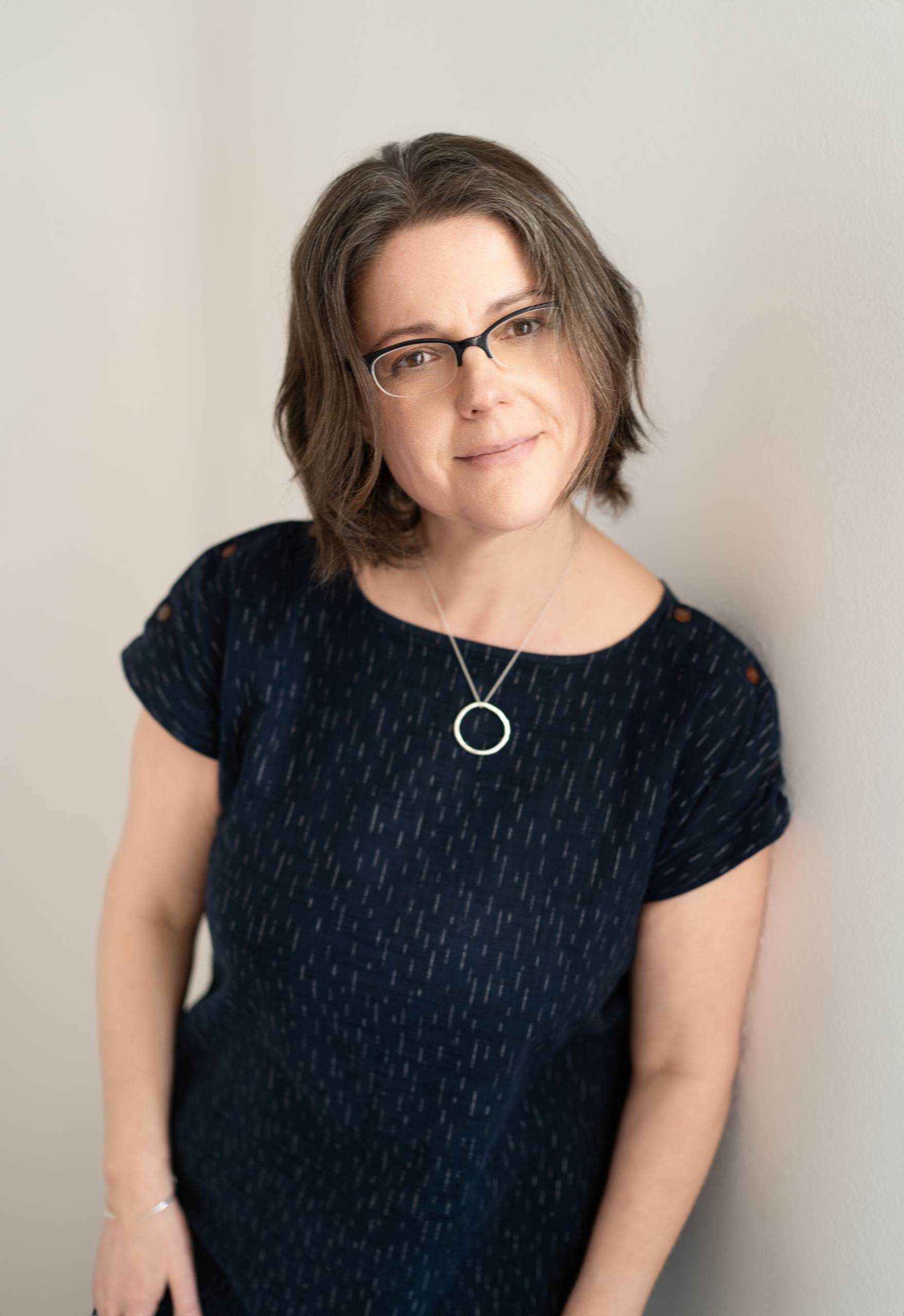 Catherine is looking at the camera.