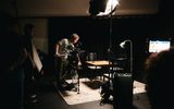 Film students on set filming a chess set