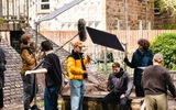 Film students getting ready to film a scene at a park