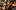 Photograph of orchestra with focus on violin player.