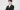 An image of Junmin Ha standing with his arms crossed